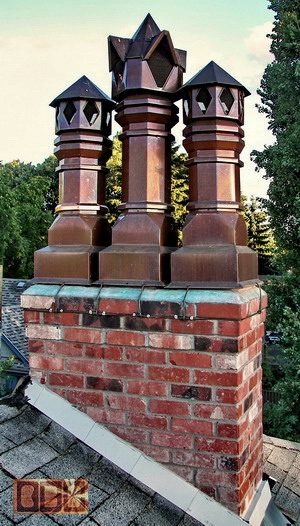 A set of 3 copper chimney flue extensions/caps for Howard in S. E. Portland, Oregon