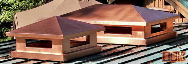 A set of 2 low profile copper chimney caps for LEA Construction in Brookings, Oregon