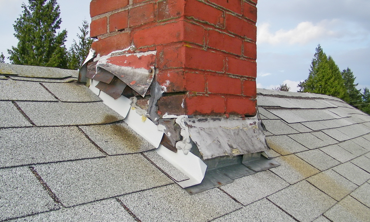 Flashing pulling away from the base of the chimney: a main cause of roof leaks. 
